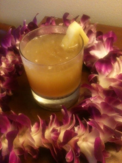 A stirred Mai Tai and fresh orchid Lei, both hand crafted by Brenda C Hill on Kauai.