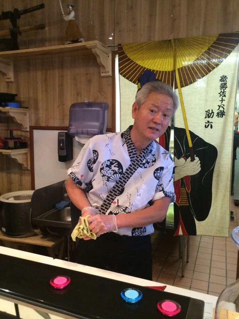 Sushi Chef handcrafting fresh fish